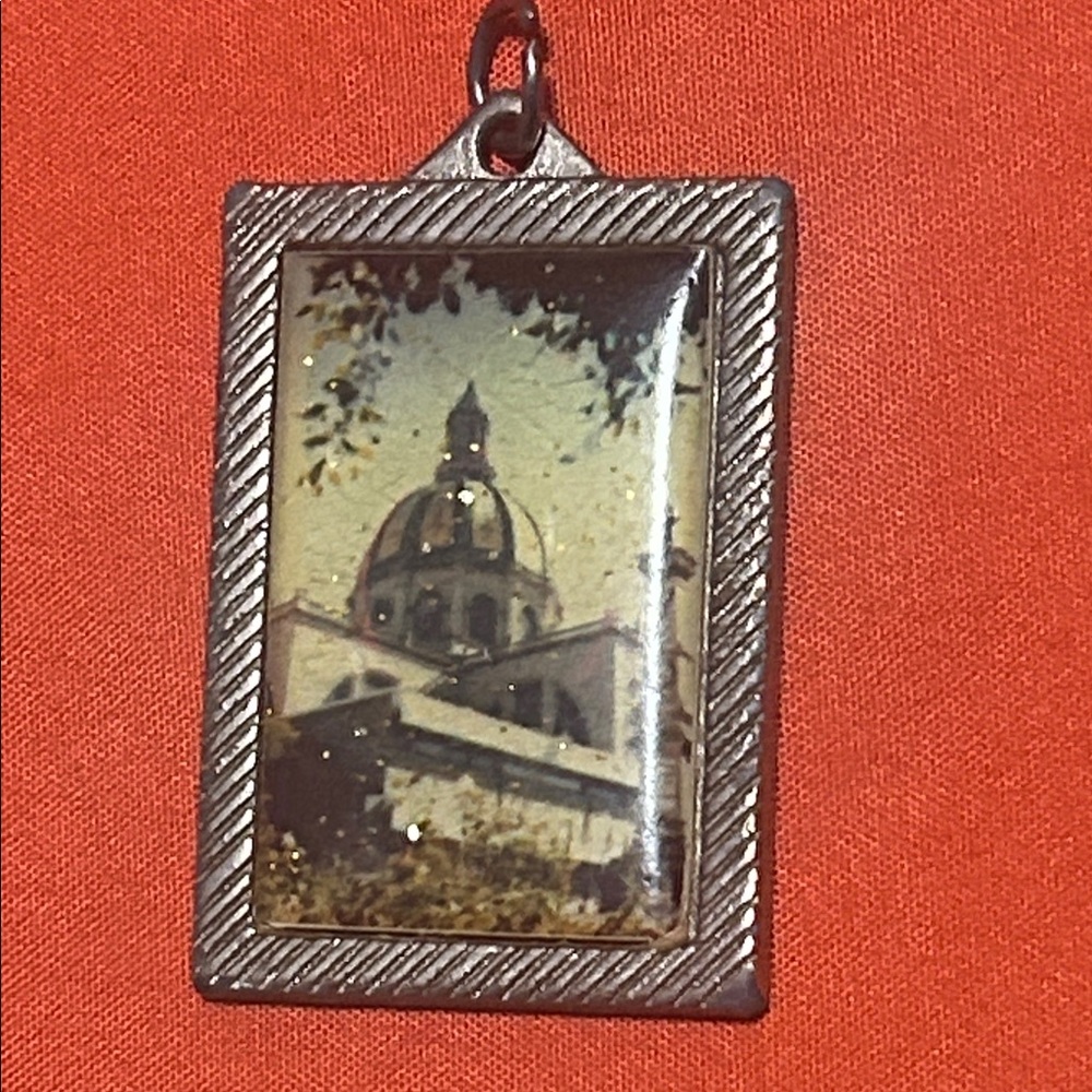 Used Silver Framed Dome Pendant of the mission in Christ on the back